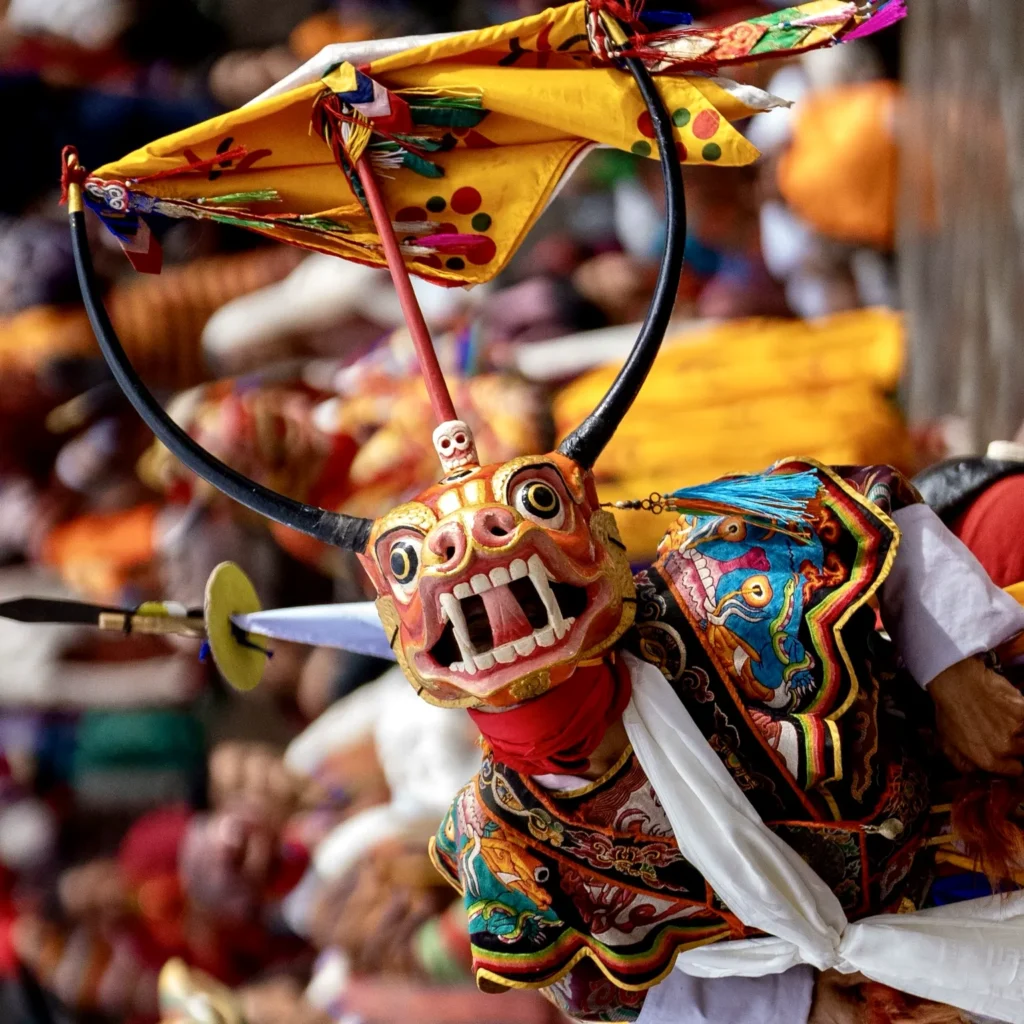 Traditional Bhutan mask dance performer in festival costume