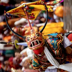 Traditional Bhutan mask dance performer in festival costume