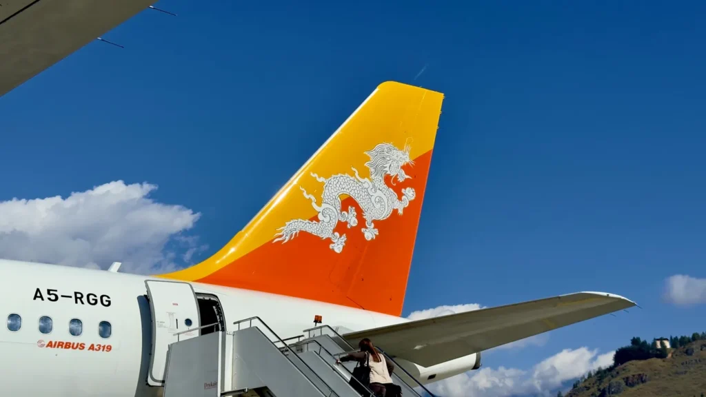Drukair aircraft at Bhutan airport with dragon tail design