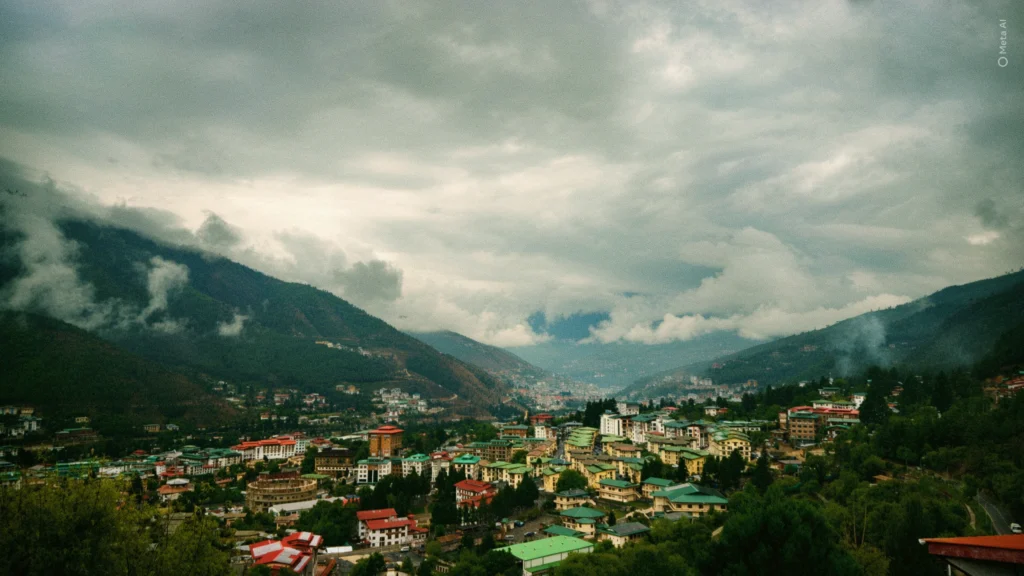 Aerial view of Thimphu city sitting in a valley beneath rolling clouds
